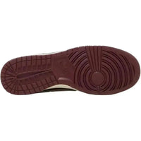 Burgundy rubber outsole of the Nike Dunk Low Retro PRM Valentine’s Day 2023 with classic circular traction pattern.