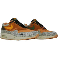 Nike Air Max 1 Atmos Safari 2016 sneaker in flax, kumquat, and chestnut with signature animal print and suede overlays.