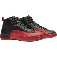 Jordan 12 Retro Flu Game 2016 in black tumbled leather with varsity red mudguard and outsole details.