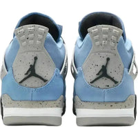 Back view of Jordan 4 University Blue sneakers featuring light blue suede, speckled cement grey heel tabs, and black Jumpman logos.